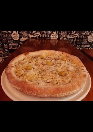 Una foto de Pizza a la piedra