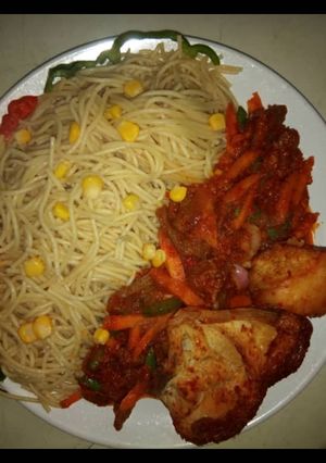 A picture of Spagetti with corn.