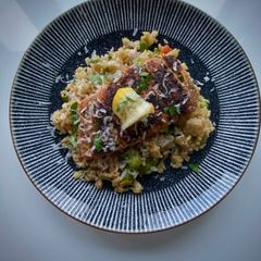 A picture of Palenquero Blackened Salmon Paella.