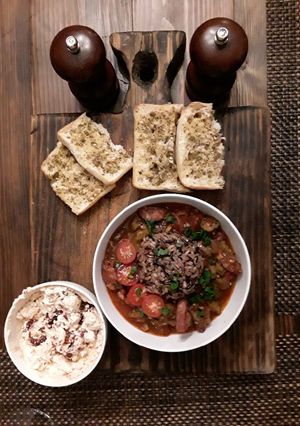 A picture of Stewed tomatoes and okra with venison.