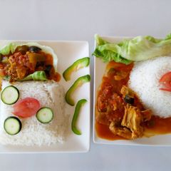 A picture of Boiled Rice with Chicken Curry Stew.