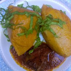 A picture of Moi moi with pepper sauce.
