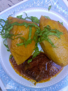 A picture of Moi moi with pepper sauce.