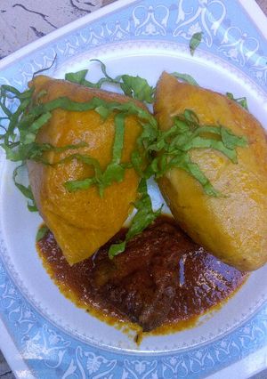 A picture of Moi moi with pepper sauce.