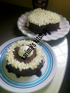 A picture of Chocolate cake with whipped cream frosting.