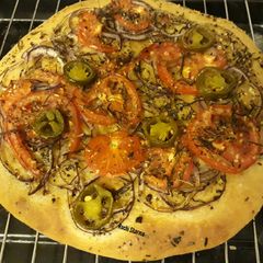 A picture of Focaccia Bread with Tomato and Herbs.