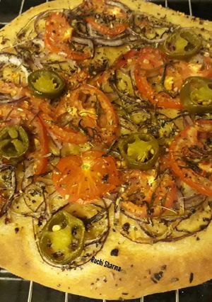 A picture of Focaccia Bread with Tomato and Herbs.