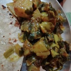 A picture of Green onion,methi sabji.