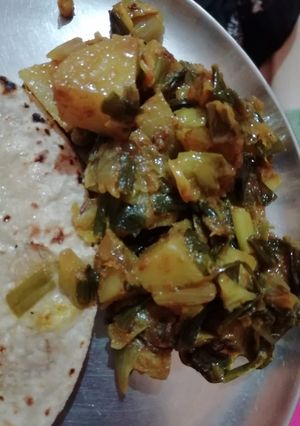 A picture of Green onion,methi sabji.
