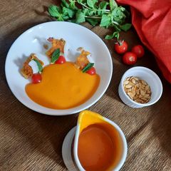 A picture of Roasted Pumpkin-Tomato soup with Potato toasties.
