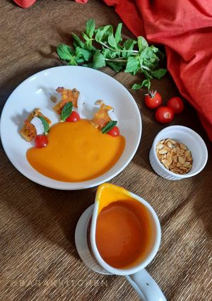 A picture of Roasted Pumpkin-Tomato soup with Potato toasties.