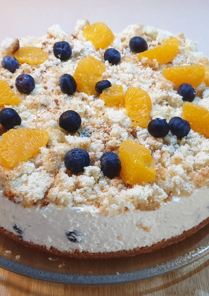 Una foto de Tarta de queso con arándanos y mandarina