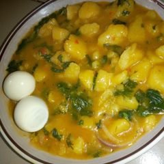 A picture of Yam porridge and boiled egg.
