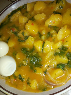 A picture of Yam porridge and boiled egg.