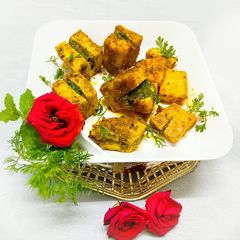 A picture of Stuffed paneer with green chutney.