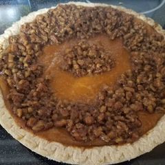 A picture of The best sweet potato pie with pecan topping.