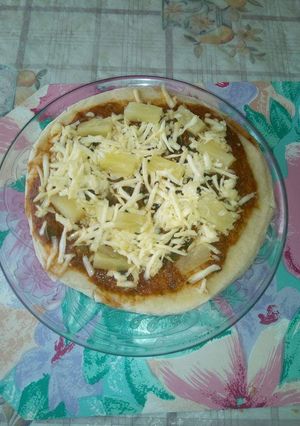 A picture of Cheesy pineapple pizza.#BakingForKids.