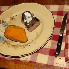 A picture of Sous Vide Strip steak with baked Sweet Potato.