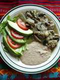 Steak in Green Sauce with Mushrooms
