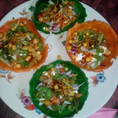 A picture of Colourful katori tokri chaat.