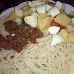A picture of Spaghetti, minced meat sauce and potato salad.