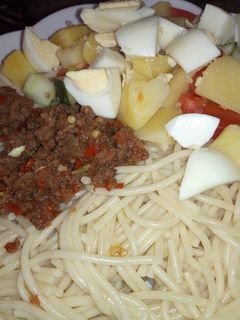 A picture of Spaghetti, minced meat sauce and potato salad.