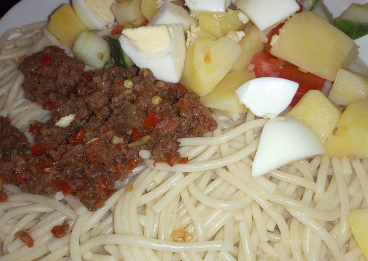 Spaghetti, minced meat sauce and potato salad
