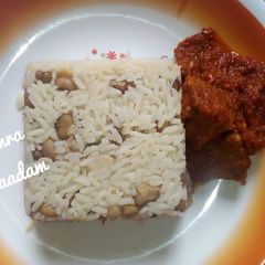 A picture of Rice and bean with tomatoes stem.