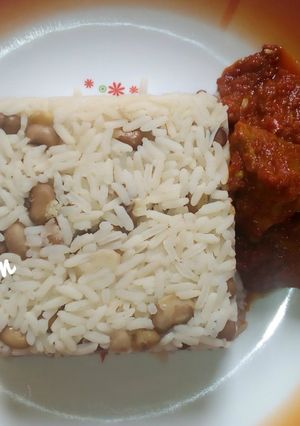 A picture of Rice and bean with tomatoes stem.