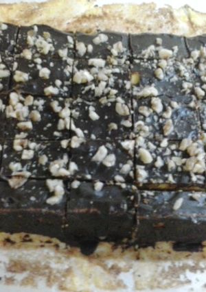 A picture of Carrot and Nuts cake with chocolate cover.