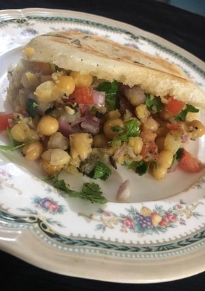 A picture of White-Peas Chaat/Stuffed Kulcha.