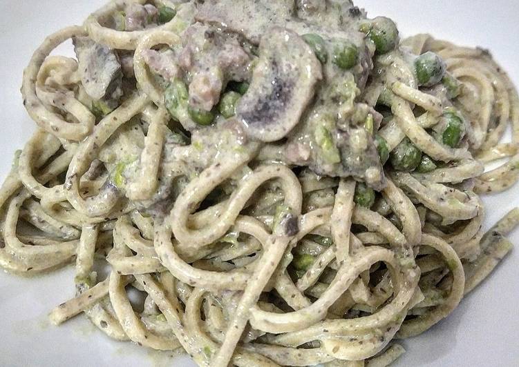 Tagliolini al Tartufo con funghi, piselli e salsiccia