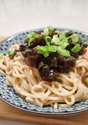 A picture of Noodles with Century Egg and Peanut Sauce.