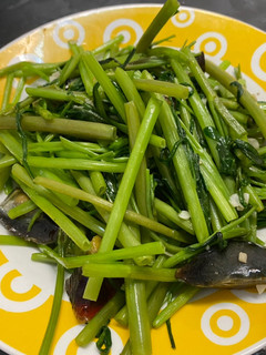 A picture of Stir-Fried Water Spinach with Century Egg.