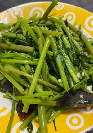 A picture of Stir-Fried Water Spinach with Century Egg.