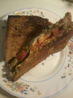 A picture of Tomato and basil grilled cheese sandwich.