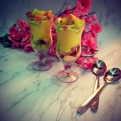 A picture of Fruits salad with custard.