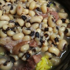 A picture of Ham, with Black Eyed Peas and Yellow Rice.