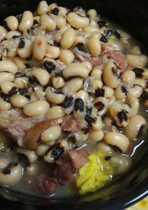 A picture of Ham, with Black Eyed Peas and Yellow Rice.