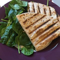 A picture of Flatbread panini with turkey and cheddar.