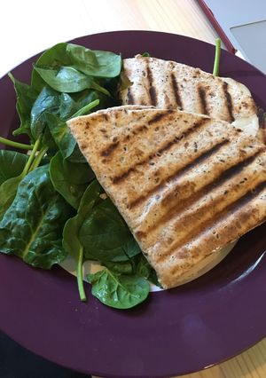 A picture of Flatbread panini with turkey and cheddar.