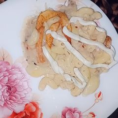 A picture of Plain white sauce pasta 🍝 with fries 🍟.