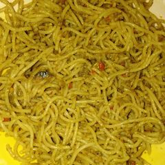 A picture of Fried spaghetti with fish and egg.
