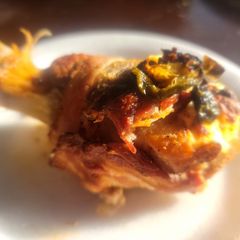 A picture of Bacon & Sirloin Wrapped, Cream Cheese Stuffed Chicken Legs.