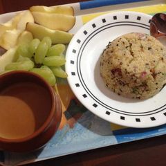 A picture of Bansi Rava Uppit,Sugarless Tea and Fruits.