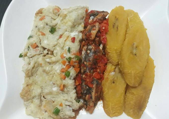 Ripe plantain with fried egg and peppered sardine