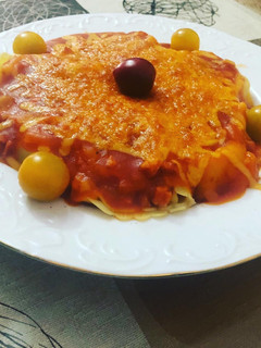 Una foto de Tortellinis relllenos de berenjena en salsa de tomate y queso cheddar