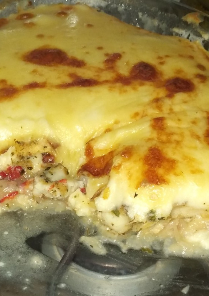 Una foto de Pescado al horno con salsa blanca y muzzarella