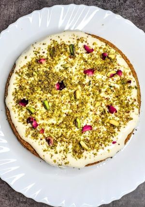 A picture of Pistachio cake with White Chocolate Glaze.