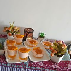 A picture of Mango jelly with mango sauce strawberry fruit custard.